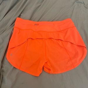 Lululemon Speed Ups, Mid-Rise, 4 inch Size 8 Tall. Color: Highlight orange speed
